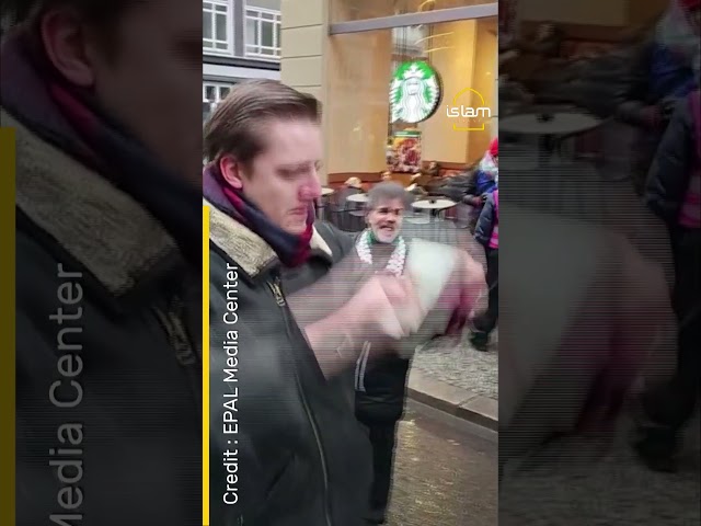 MOMENT MAN ASHAMED OF BEING GERMAN RIPS PASSPORT DURING PRO-PALESTINE PROTEST
