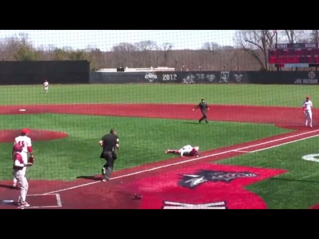 Catcher Tries To Blow Ball Foul To Save a Run