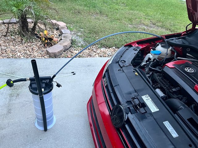 Using a fluid extractor to change my oil.