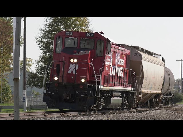 Cars roll by without engine Tagged up RJ Corman Railpower genset on bad track Wooster Ohio RJC 2012