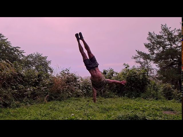 Hand balancing & tricking in pouring rain! Super slow motion calisthenics video