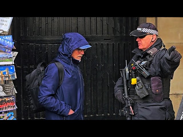 GET OUT! ARMED POLICE OFFICER tells IDIOT TOURIST who doesn't listen at Horse Guards!