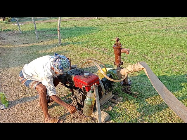 A skill farmer try to start a 5hp diesel engine water pump. 5hp engine water pump start process