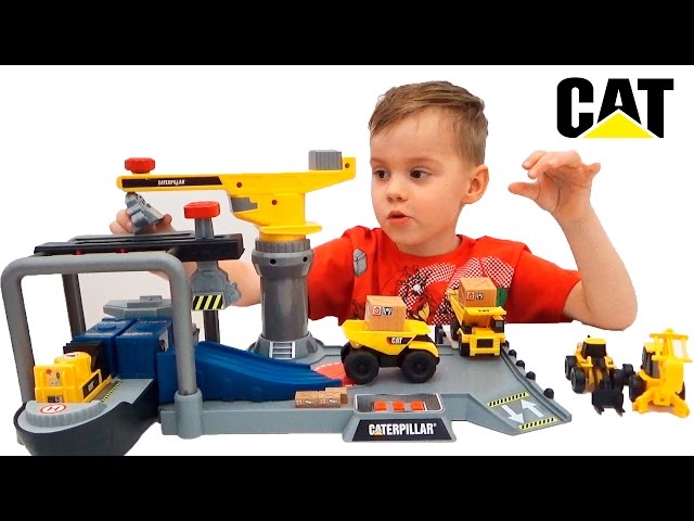 Game set Caterpillar cargo port. Unpacking Construction CAT Video for children