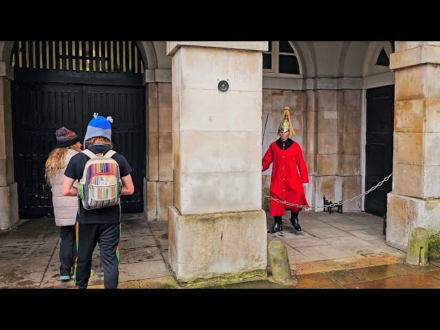 IDIOTS forget their UMBRELLA and are told GET OUT OF THE ARCHES! on a rainy day at Horse Guards!