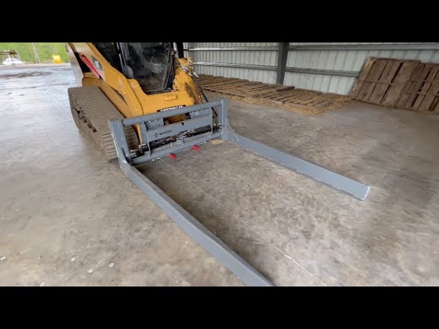 New Norden Bale Squeeze on the Farm! Pick up 50 bales with a skidsteer! Re-upload with added footage