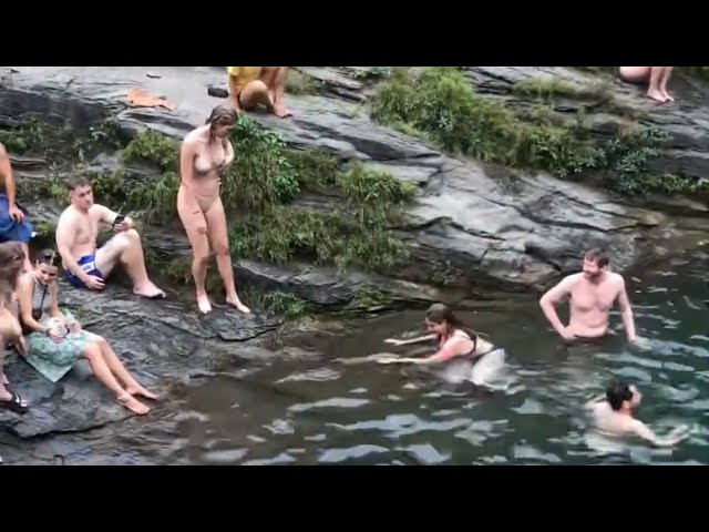 Girls swimming in waterfalls. Du Gia waterfall