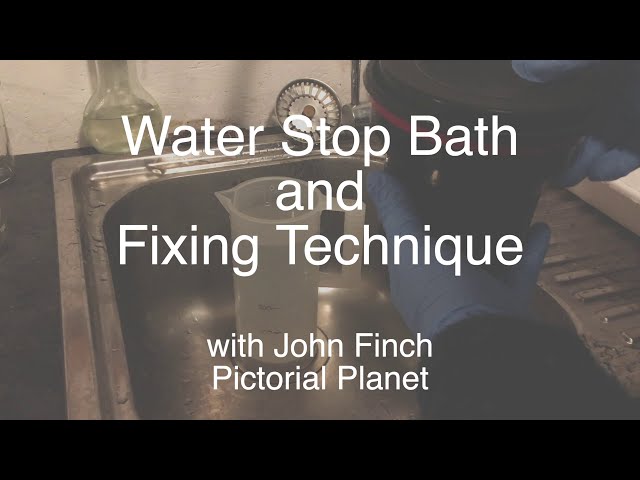 Film water-stop bath and fixing technique for Pyrocat-HD and other developers.