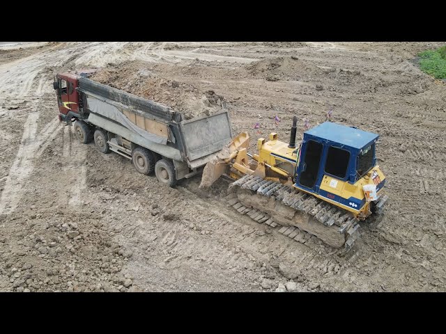 Skillfully Komatsu Bulldozer Operated pushing land with Dumping truck |Machine Kh
