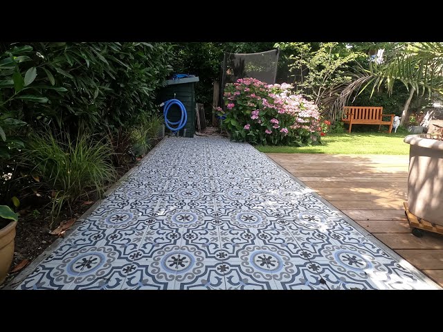 Nicole's turning old concrete gravel pavers into a great Portuguese patio