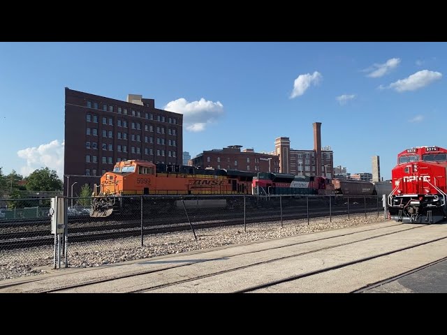 BNSF #5999 leads WB Grain Train with Ferromex Power. Kansas City, MO 5/18/24