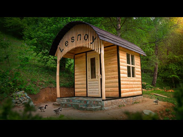 Do-it-yourself wooden house in the forest. Alone with nature