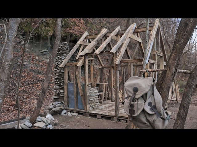 Building a house from pallets near the river