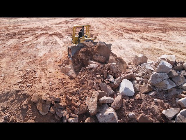 Wonderful Komatsu Dozers D65E Show Technique Push Stone Mixed Rock With Many Dump Trucks Team