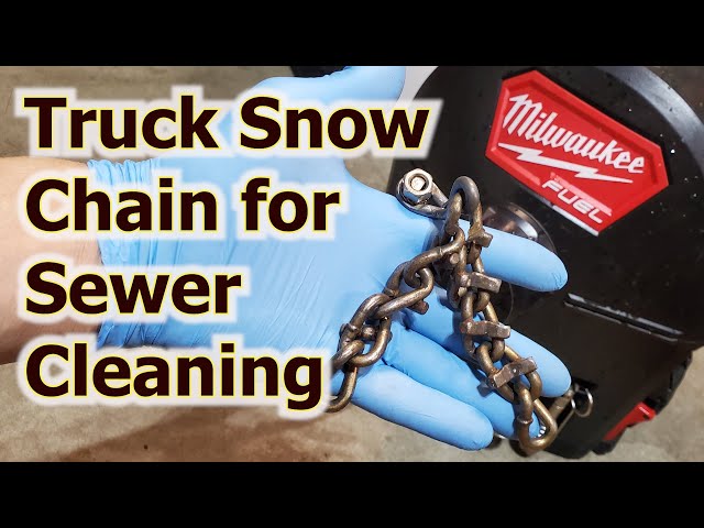 Cleaning Sewer Pipe with Truck Snow Chain. Drain Cleaning
