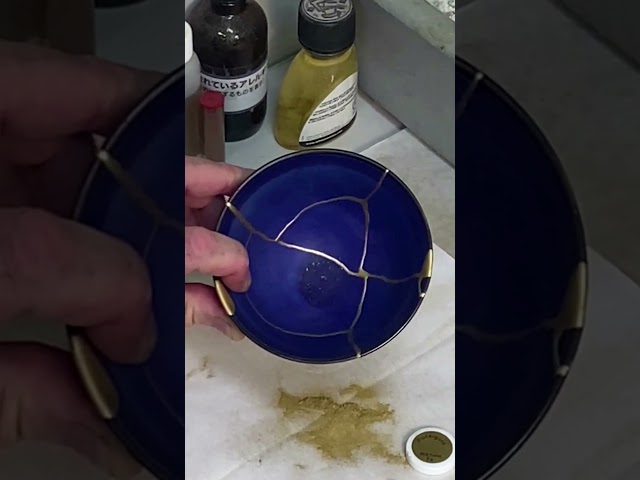 Gold Kintsugi bowl adding Rebirth symbol