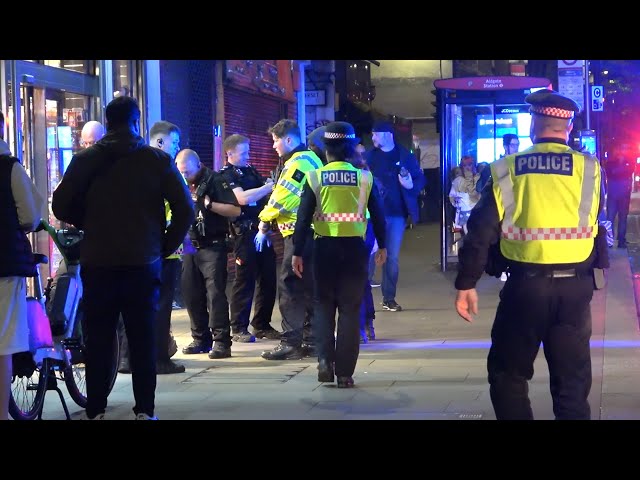 Police vehicles responding and arrest in Aldgate, London