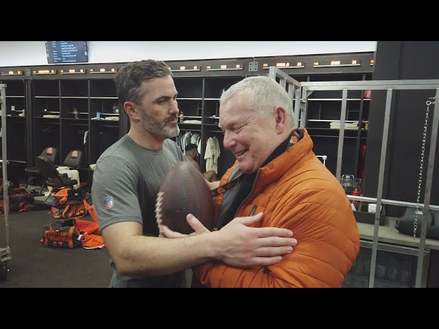 Jim Donovan receives the game ball from Kevin Stefanski and the Cleveland Browns