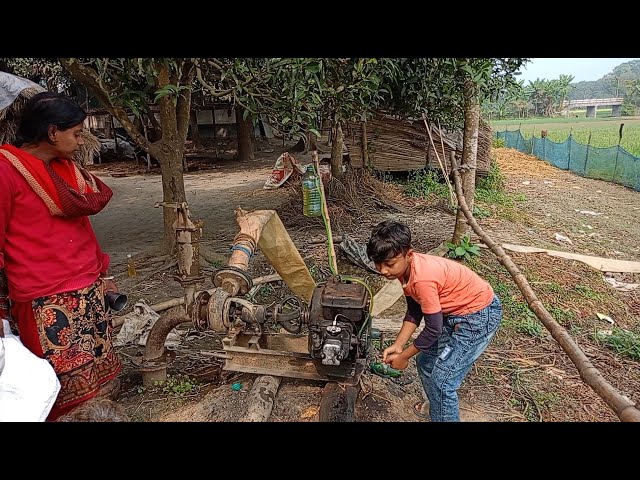 Boys are trying to start a 4hp water pump. They are trying to raised water by 4hp diesel engine.