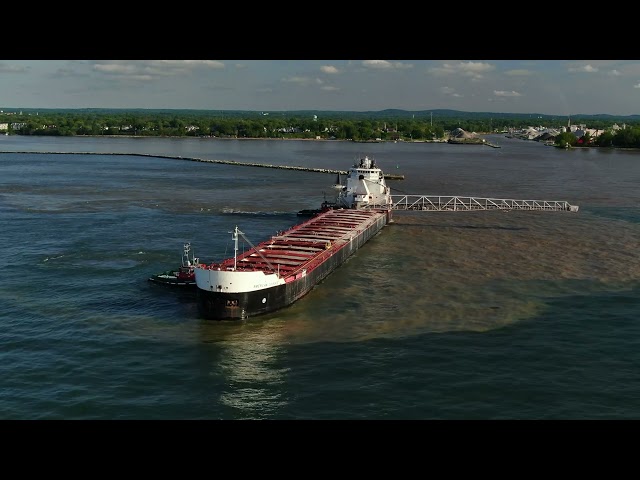 MV American Courage ship aground at Fairport Harbor with Great Lakes Towing Tug assist