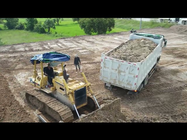 Big Dump trucks dumping rock to Bulldozer pushing to filling up landscape | Machine Kh