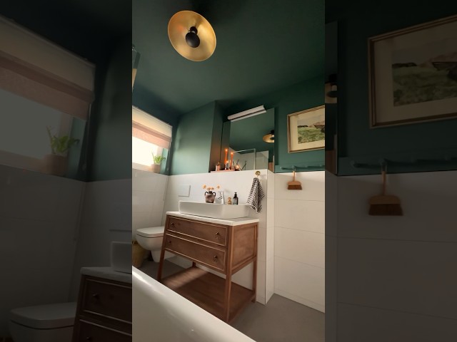 The coziest dark green bathroom