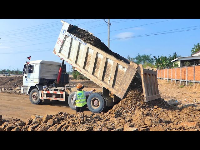 Best Dump Truck Working Drive Back Unloading Pouring soil into a road under construction Bulldozer