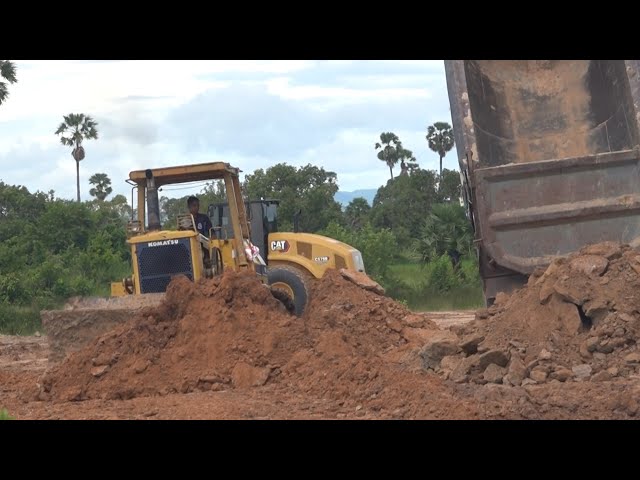 Big team Bulldozers and Dump trucks operated trusting rock and stone | Machine Kh