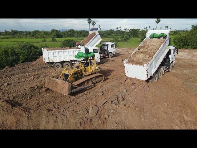 Big teams dump trucks and Komatsu Bulldozers operated land filling up | Machine Kh
