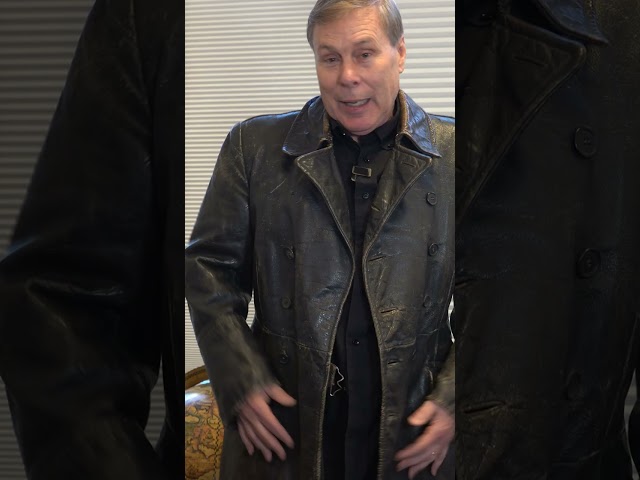 Tom becomes a fashion model and tries on a WW2 trench coat