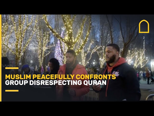 MUSLIM peacfully confronts group disrespecting the Quran