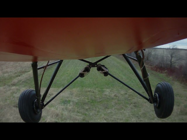 Pietenpol belly-mounted shot of field landing