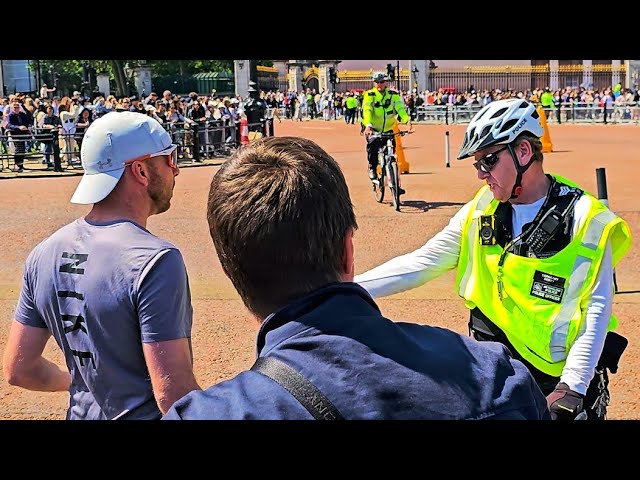 BUCKINGHAM PALACE. ONE IDIOT UPSETS THE POLICE during the Guard change, despite no King's Guard!