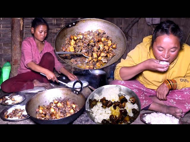 Young girls are cooking and eating pork meat curry in rural Nepal || Local pork curry cooking