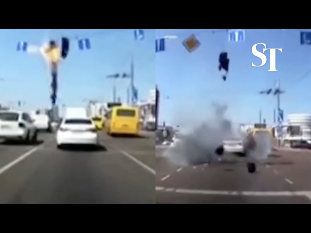 Dashcam video captures missile debris falling near Kyiv car