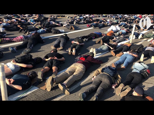 Protesters lay across Portland's Burnside Bridge for nine minutes in memory of George Floyd