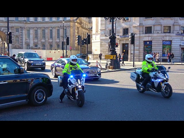 Police escort Princess Anne through Trafalgar Square