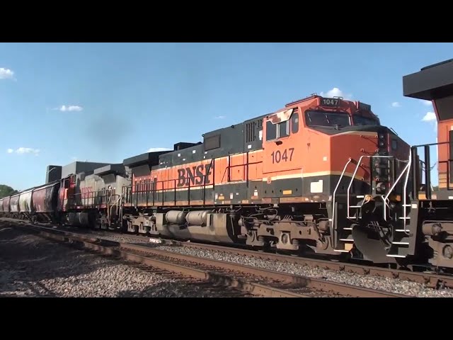 BNSF #7938 Leads WB Grain Train with H1 Dash 9 And BNSF Warbonnet Trailing. Olathe, KS 5/11/24
