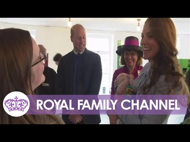 Kate Cuddles Baby During Charity Visit