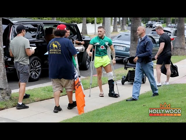 Conor McGregor signs autographs on crutches in Beverly Hills