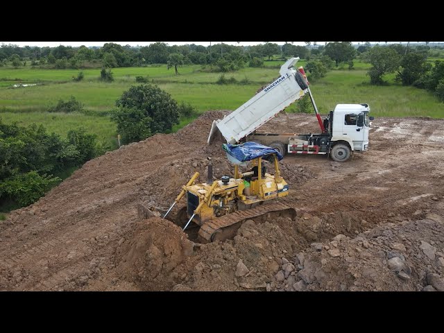 Super operator Bulldozer and Dump trucks dumping and pushing rock | Machine Kh