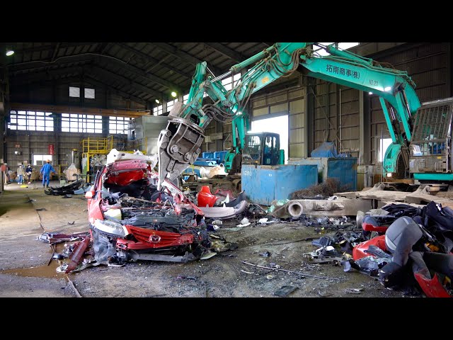 The process of crushing everything. A Japanese factory recycling cars and appliances.