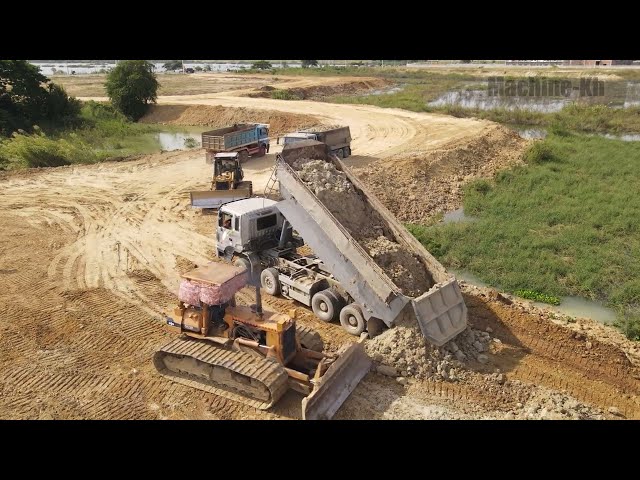 Super Dozer Komatsu showing technique pushing soil to clearing water area | Machine Kh