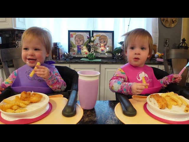 Twins try fish and chips with tartar sauce