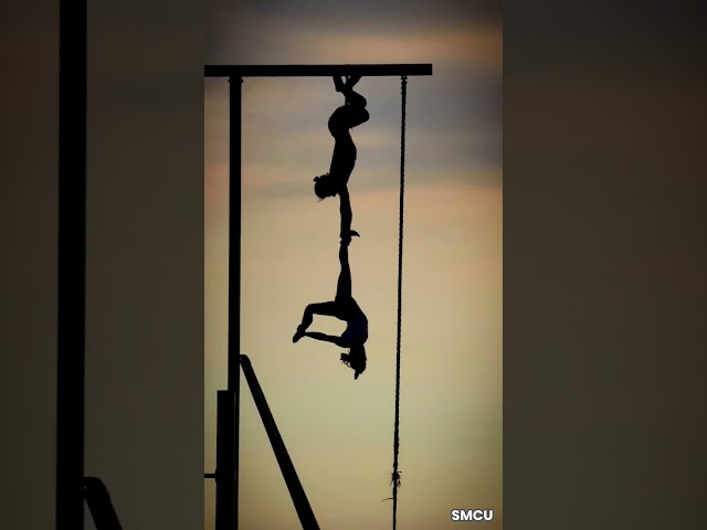 Silhouettes Against the Sunset: Acrobatic Duo Dazzles at Santa Monica's Muscle Beach
