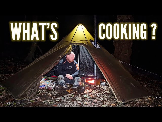 Winter hot tent camping: Woodstove cooking.