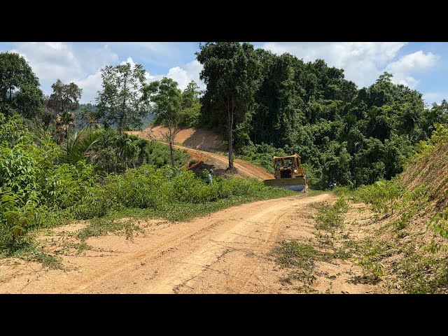 Caterpillar Bulldozer Builds New Road on Mountain at Full Power