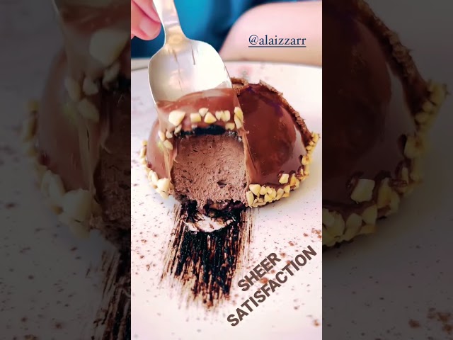 SATISFACTION 🍫 Delectable chocolate mousse dessert being cut