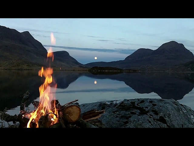 Real Lakeside Wild Campfire (no loop) with full moon rising and crackling logs, Scottish Highlands.