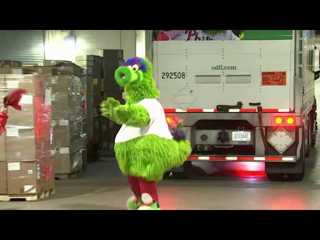 Phillie Phanatic helps back truck into Citizens Bank Park as team loads up for Clearwater